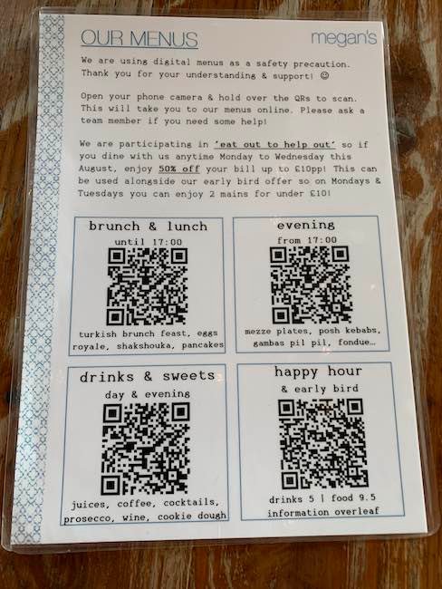 a photo of the megans 'menu' during lockdown - it contains 4 QR codes rather than the menu.